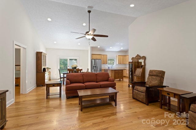 99 Pinecrest Estates Dr, Flat Rock, NC 28731 - living room with ceiling fan, light wood-style floors, plenty of natural light, lofted ceiling, and recessed lighting