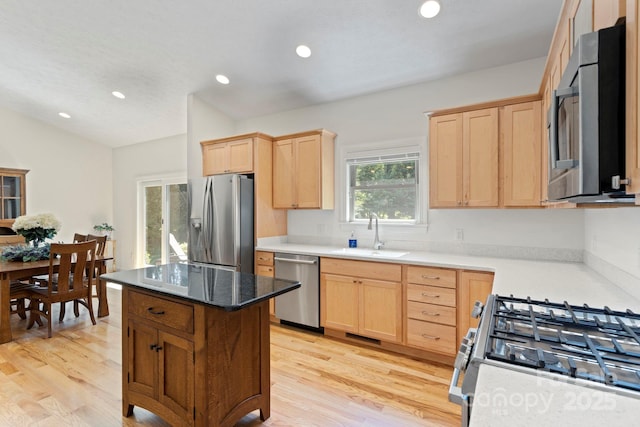 99 Pinecrest Estates Dr, Flat Rock, NC 28731 - kitchen with appliances with stainless steel finishes, light brown cabinetry, light wood finished floors, recessed lighting, and lofted ceiling