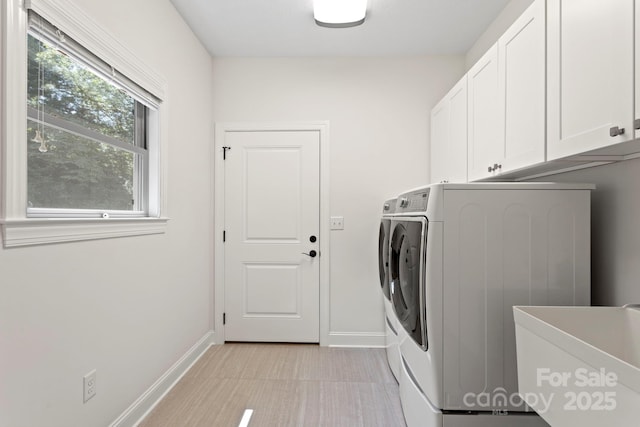 99 Pinecrest Estates Dr, Flat Rock, NC 28731 - washroom featuring cabinet space and separate washer and dryer
