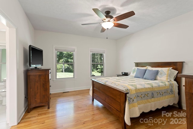 99 Pinecrest Estates Dr, Flat Rock, NC 28731 - bedroom featuring light wood-style floors and a ceiling fan