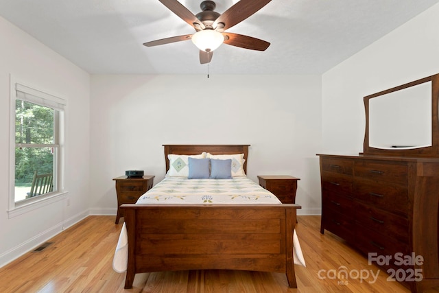 99 Pinecrest Estates Dr, Flat Rock, NC 28731 - bedroom with light wood-style flooring and a ceiling fan
