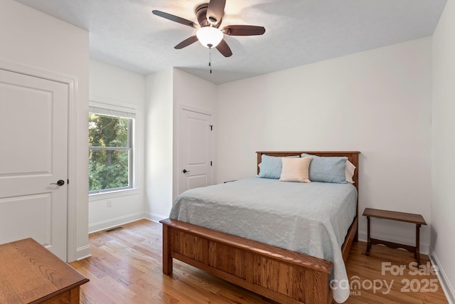 99 Pinecrest Estates Dr, Flat Rock, NC 28731 - bedroom with light wood-type flooring and a ceiling fan