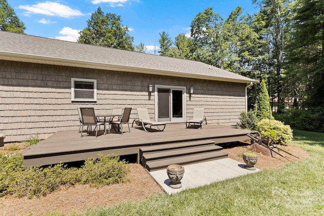 99 Pinecrest Estates Dr, Flat Rock, NC 28731 - back of property featuring a shingled roof, a wooden deck, and outdoor dining area