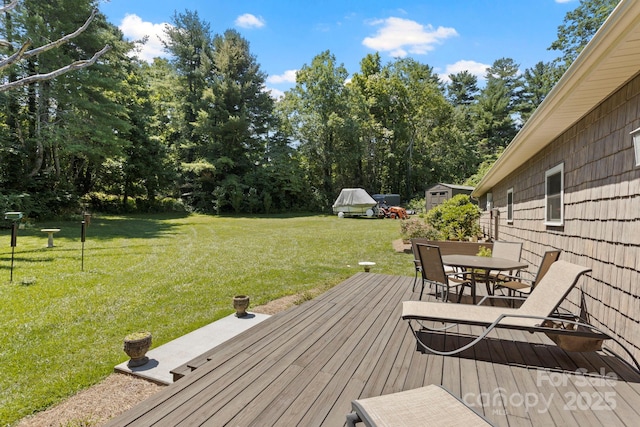 99 Pinecrest Estates Dr, Flat Rock, NC 28731 - wooden deck featuring outdoor dining area, a yard, and a shed
