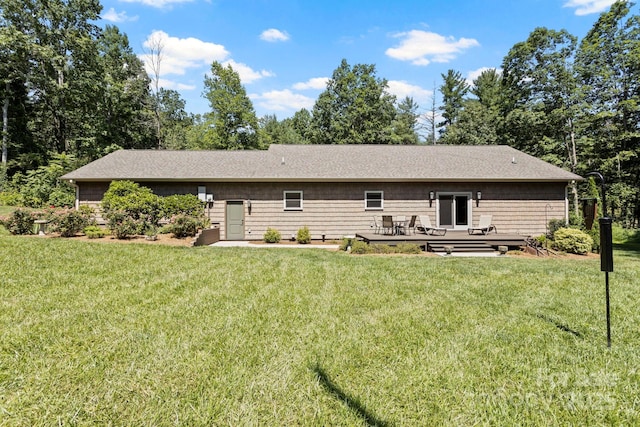 99 Pinecrest Estates Dr, Flat Rock, NC 28731 - rear view of property featuring a lawn, a shingled roof, and a wooden deck