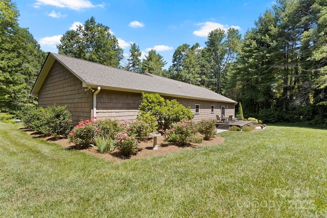 99 Pinecrest Estates Dr, Flat Rock, NC 28731 - view of property exterior featuring a lawn and a shingled roof