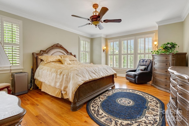 340 Harrison Rd, Roebuck, SC 29376 - bedroom with multiple windows, light wood-style floors, a ceiling fan, and crown molding
