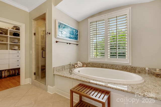 340 Harrison Rd, Roebuck, SC 29376 - full bathroom with a shower stall, a garden tub, a walk in closet, and tile patterned flooring