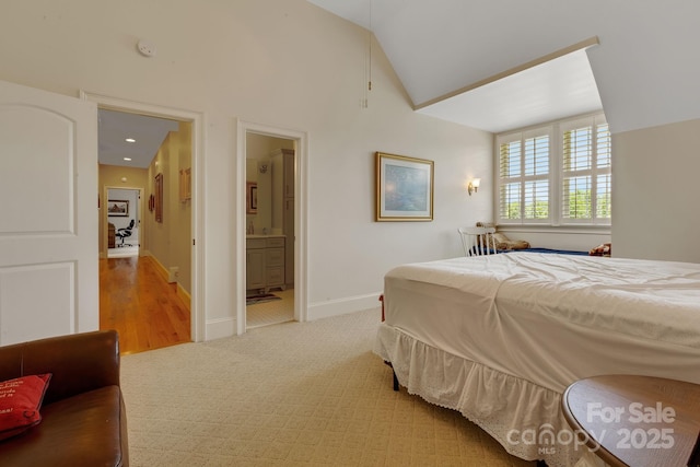 340 Harrison Rd, Roebuck, SC 29376 - bedroom featuring light colored carpet, vaulted ceiling, and ensuite bath