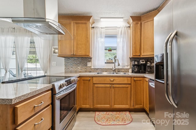 121 Kee Rd, Belmont, NC 28012 - kitchen featuring stainless steel appliances, island range hood, tasteful backsplash, brown cabinetry, and a peninsula