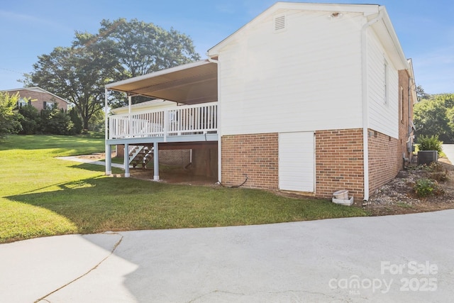 121 Kee Rd, Belmont, NC 28012 - view of home's exterior featuring brick siding, a lawn, stairs, and a deck
