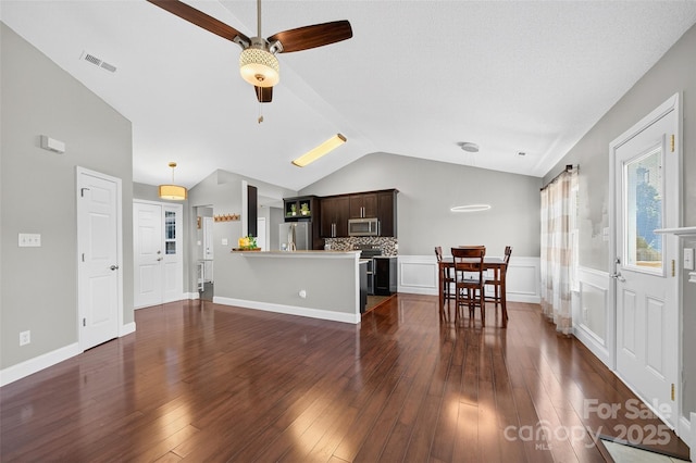 118 Milroy Ln Unit 171, Mooresville, NC 28115 - living area with vaulted ceiling, a ceiling fan, and dark wood finished floors