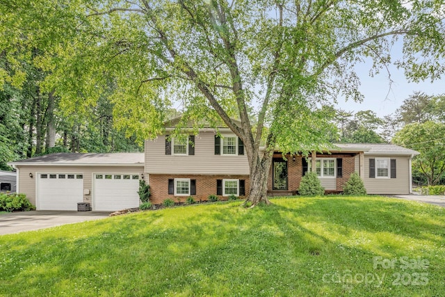 213 Turkey Hill Dr, King, NC 27021 - tri-level home with driveway, an attached garage, brick siding, and a front yard