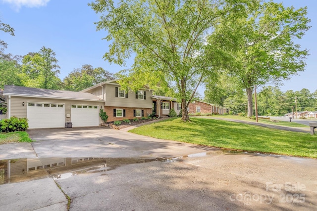 213 Turkey Hill Dr, King, NC 27021 - split level home featuring brick siding, a garage, concrete driveway, and a front lawn