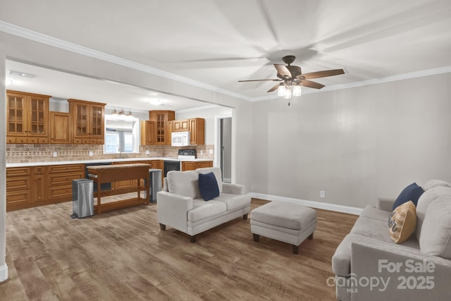 213 Turkey Hill Dr, King, NC 27021 - living room featuring wood finished floors, ceiling fan, and crown molding
