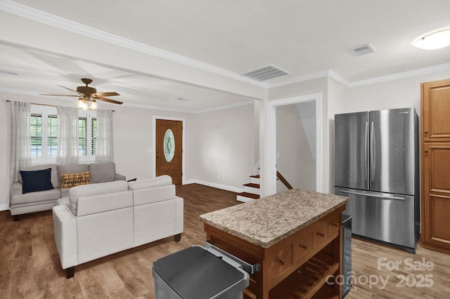 213 Turkey Hill Dr, King, NC 27021 - living area with light wood-style floors, ornamental molding, a ceiling fan, and stairs