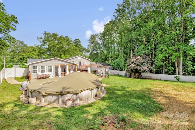 213 Turkey Hill Dr, King, NC 27021 - rear view of house featuring a hot tub, a fenced backyard, a gate, and view of wooded area