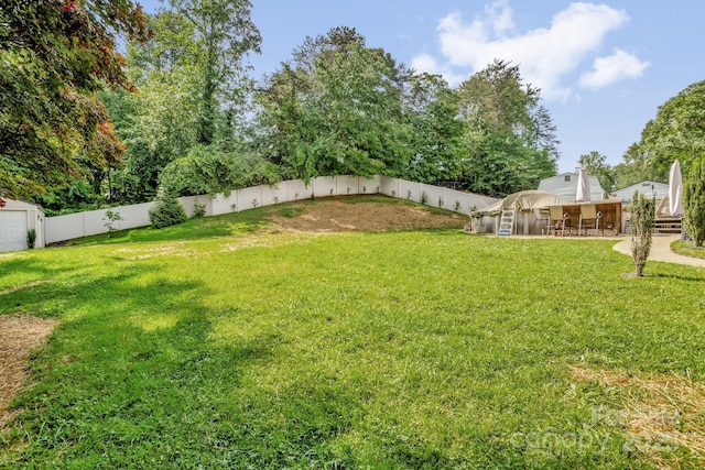 213 Turkey Hill Dr, King, NC 27021 - fenced backyard featuring an outdoor structure