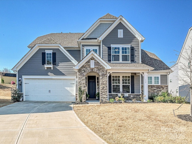 104 Hemlock Cove Ct Unit 125, Mooresville, NC 28117 - view of front of house with stone siding, driveway, a shingled roof, and a porch