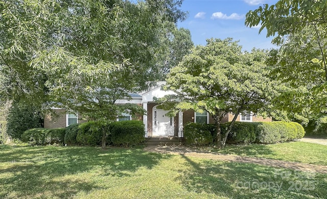 208 N Gaston St, Kings Mountain, NC 28086 - obstructed view of property with brick siding and a front yard