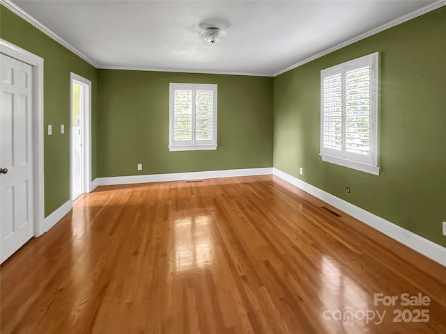 208 N Gaston St, Kings Mountain, NC 28086 - empty room featuring wood finished floors and ornamental molding