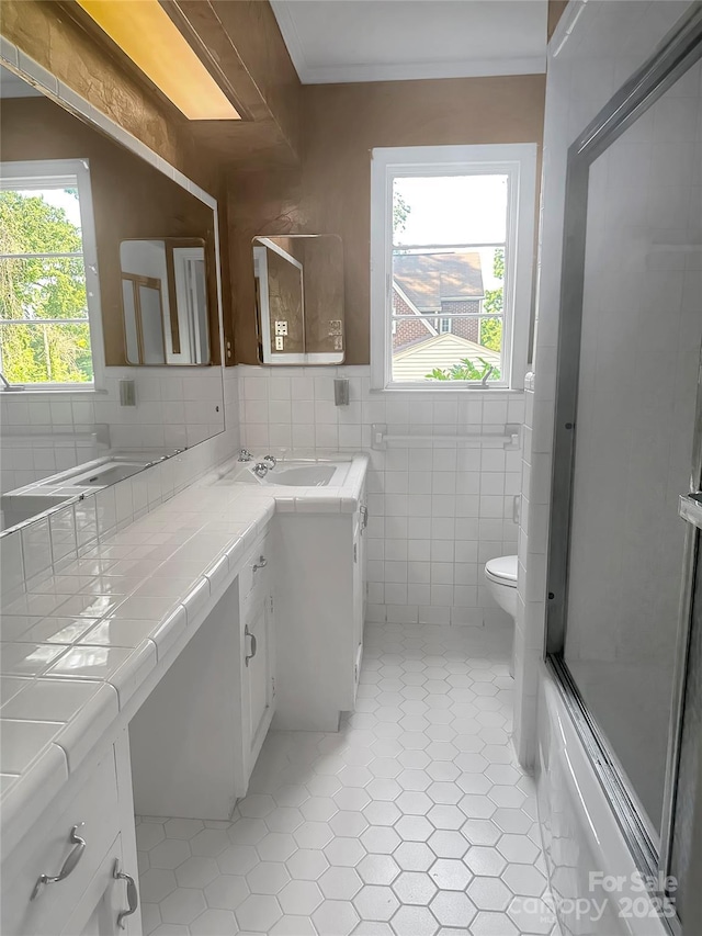 208 N Gaston St, Kings Mountain, NC 28086 - bathroom featuring vanity, healthy amount of natural light, and tile walls