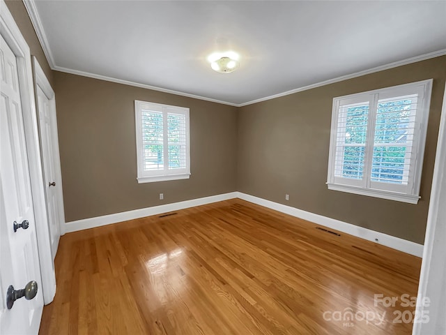 208 N Gaston St, Kings Mountain, NC 28086 - unfurnished bedroom with light wood-style floors and crown molding