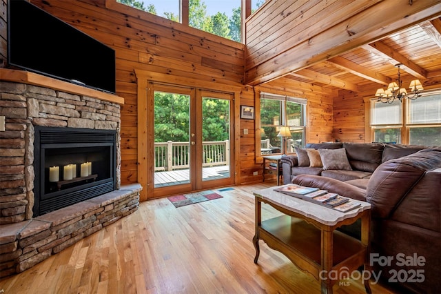 599 Shoal Creek Trl, Nebo, NC 28761 - living area featuring a chandelier, healthy amount of natural light, hardwood / wood-style floors, wooden walls, and a wooden ceiling with exposed beams