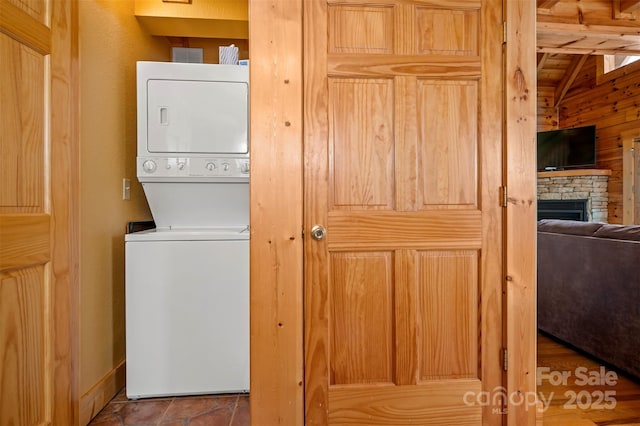 599 Shoal Creek Trl, Nebo, NC 28761 - washroom with stacked washer and clothes dryer and a fireplace