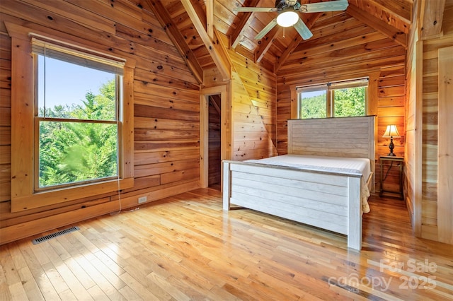 599 Shoal Creek Trl, Nebo, NC 28761 - unfurnished bedroom featuring light wood-style flooring, wood walls, and wooden ceiling