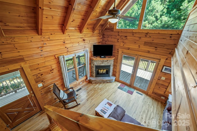 599 Shoal Creek Trl, Nebo, NC 28761 - living room with wooden walls, plenty of natural light, a wood ceiling with exposed beams, wood finished floors, and a ceiling fan