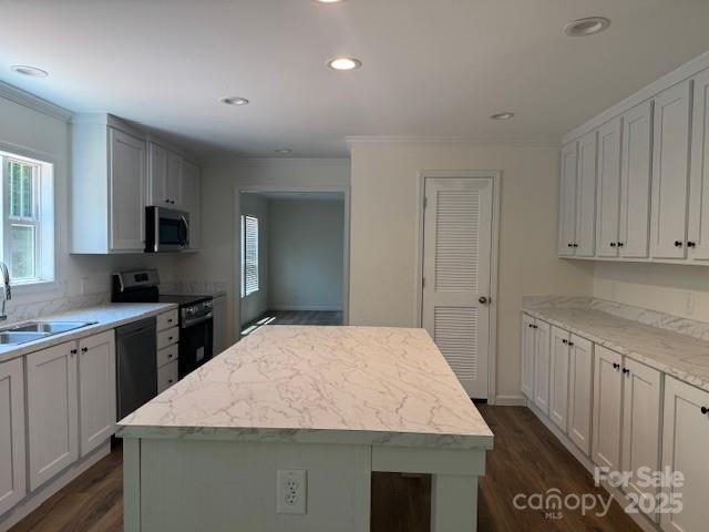 4163 Tallent Rd, Morganton, NC 28655 - kitchen with black appliances, crown molding, dark wood-style floors, a kitchen island, and recessed lighting