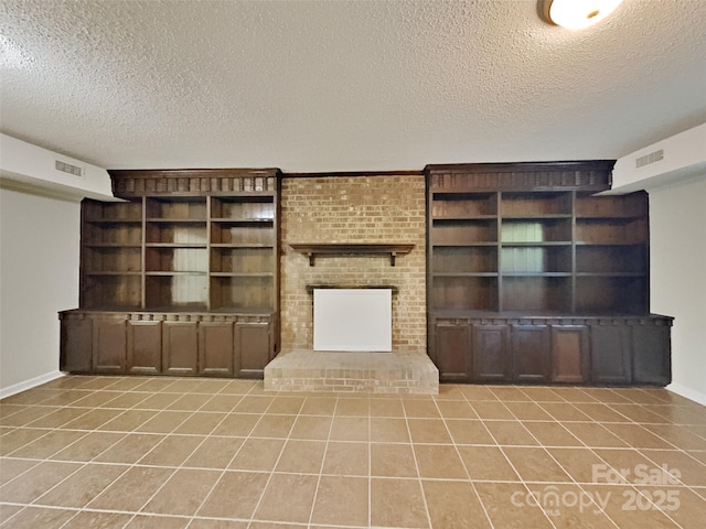 7420 Castlebar Rd, Charlotte, NC 28270 - unfurnished living room featuring a textured ceiling, light tile patterned floors, a fireplace, and built in shelves
