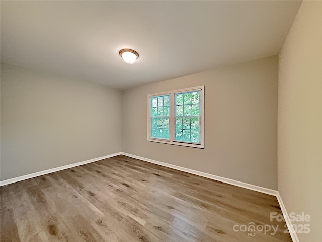 7420 Castlebar Rd, Charlotte, NC 28270 - spare room featuring wood finished floors and baseboards