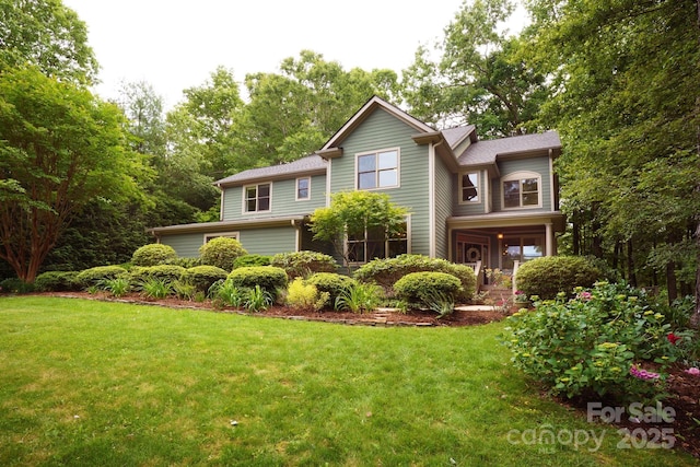 25 Madelyn Ln, Fairview, NC 28730 - traditional-style house featuring a front yard and view of scattered trees