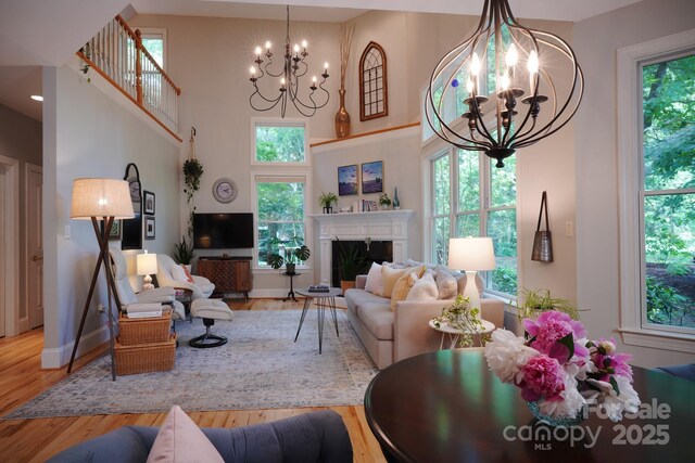 25 Madelyn Ln, Fairview, NC 28730 - living area featuring a chandelier, plenty of natural light, a high ceiling, and wood finished floors