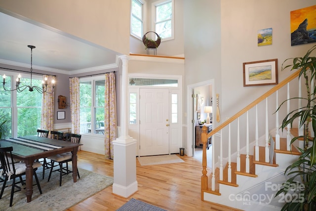 25 Madelyn Ln, Fairview, NC 28730 - entrance foyer featuring light wood-style flooring, stairs, a chandelier, healthy amount of natural light, and crown molding