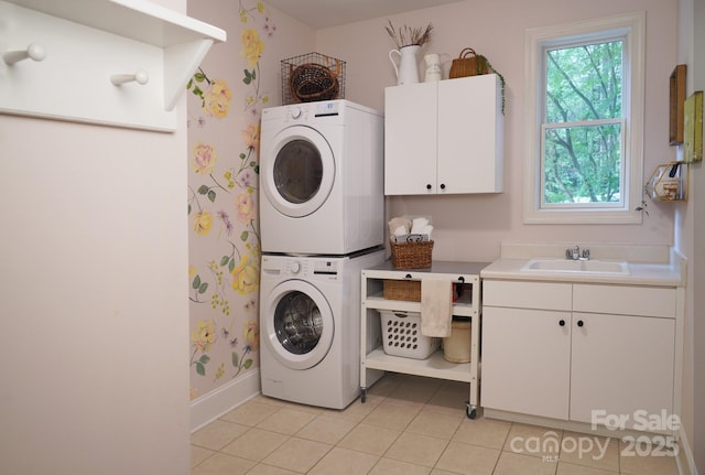 25 Madelyn Ln, Fairview, NC 28730 - washroom featuring stacked washer / dryer, cabinet space, and light tile patterned flooring