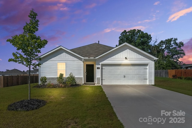 130 St James Way, Sanford, NC 27332 - ranch-style house with concrete driveway, a garage, board and batten siding, and a shingled roof