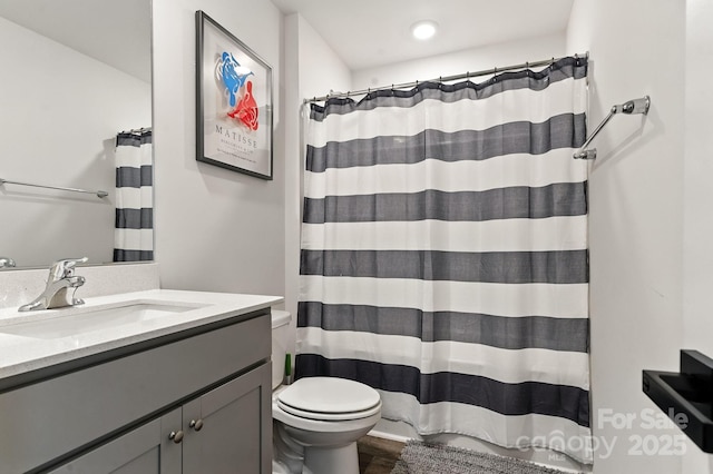 130 St James Way, Sanford, NC 27332 - full bathroom featuring vanity, wood finished floors, and a shower with curtain