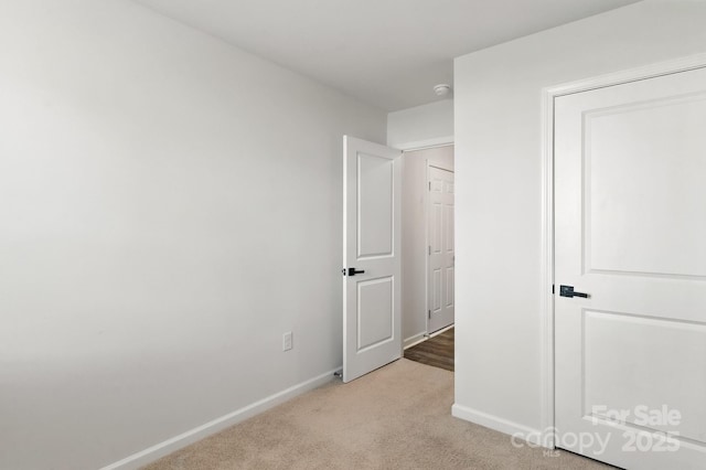 130 St James Way, Sanford, NC 27332 - unfurnished bedroom featuring light carpet and baseboards