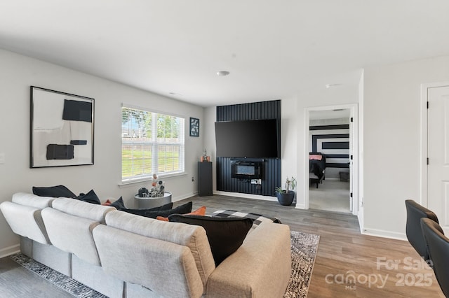 130 St James Way, Sanford, NC 27332 - living room featuring light wood-type flooring and baseboards