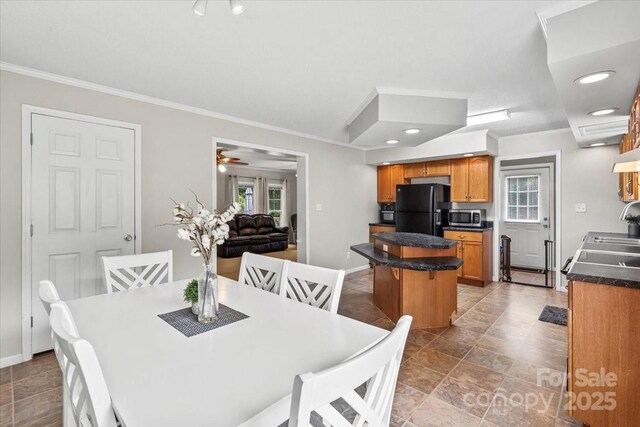 1764 Tomlinson Loop, Connelly Springs, NC 28612 - dining area featuring healthy amount of natural light and ornamental molding