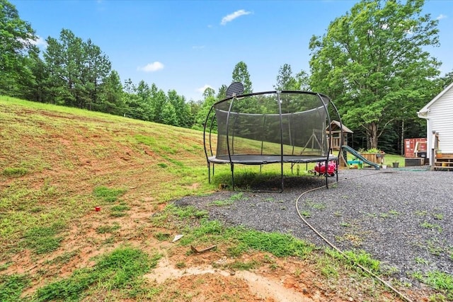 1764 Tomlinson Loop, Connelly Springs, NC 28612 - view of green lawn with a trampoline and a playground