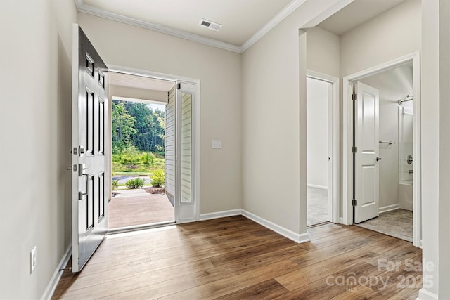 5846 Oak Branch Cir, Maiden, NC 28650 - entryway with crown molding and wood finished floors
