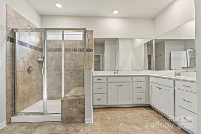 5846 Oak Branch Cir, Maiden, NC 28650 - bathroom with double vanity, a shower stall, and recessed lighting