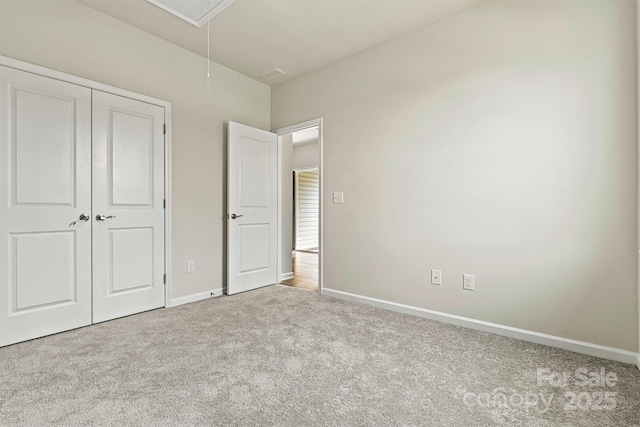 5846 Oak Branch Cir, Maiden, NC 28650 - unfurnished bedroom with attic access, carpet flooring, and a closet