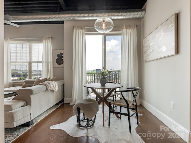2338 Yadkin Ave Unit 505, Charlotte, NC 28205 - dining room featuring baseboards and concrete floors