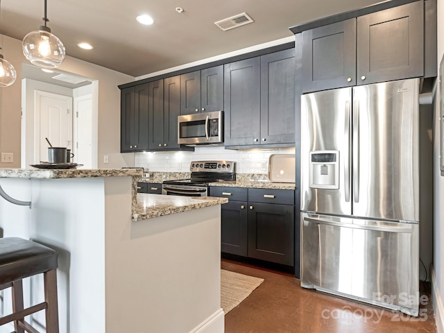 2338 Yadkin Ave Unit 505, Charlotte, NC 28205 - kitchen with appliances with stainless steel finishes, backsplash, a kitchen breakfast bar, recessed lighting, and light stone countertops