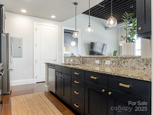 2338 Yadkin Ave Unit 505, Charlotte, NC 28205 - kitchen with stainless steel appliances, dark cabinets, pendant lighting, light stone counters, and recessed lighting